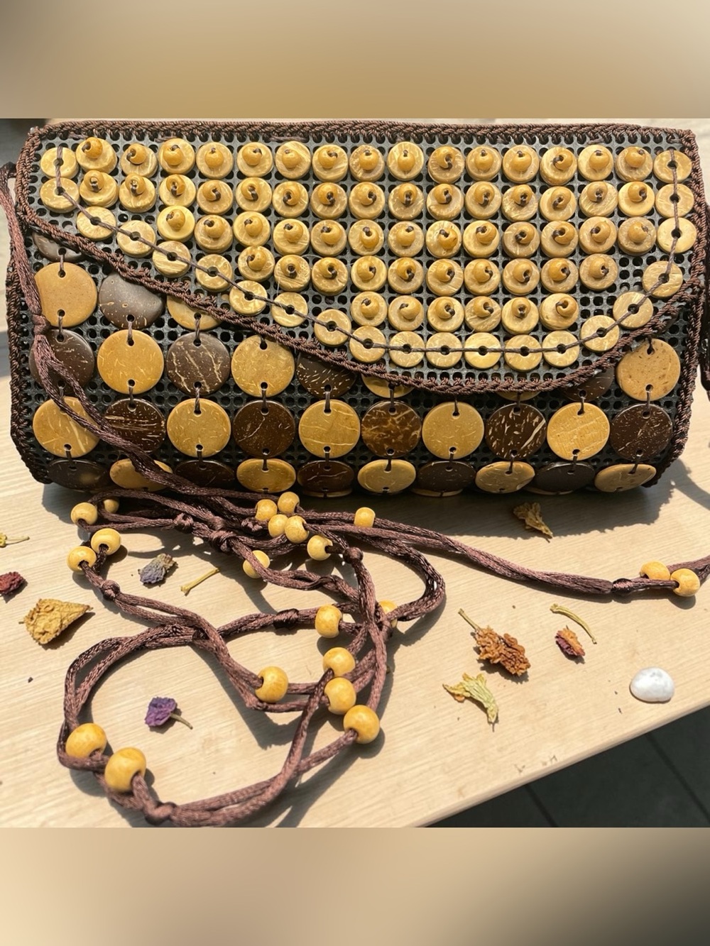 Handmade boho bag with coconut shell discs and wooden beads.